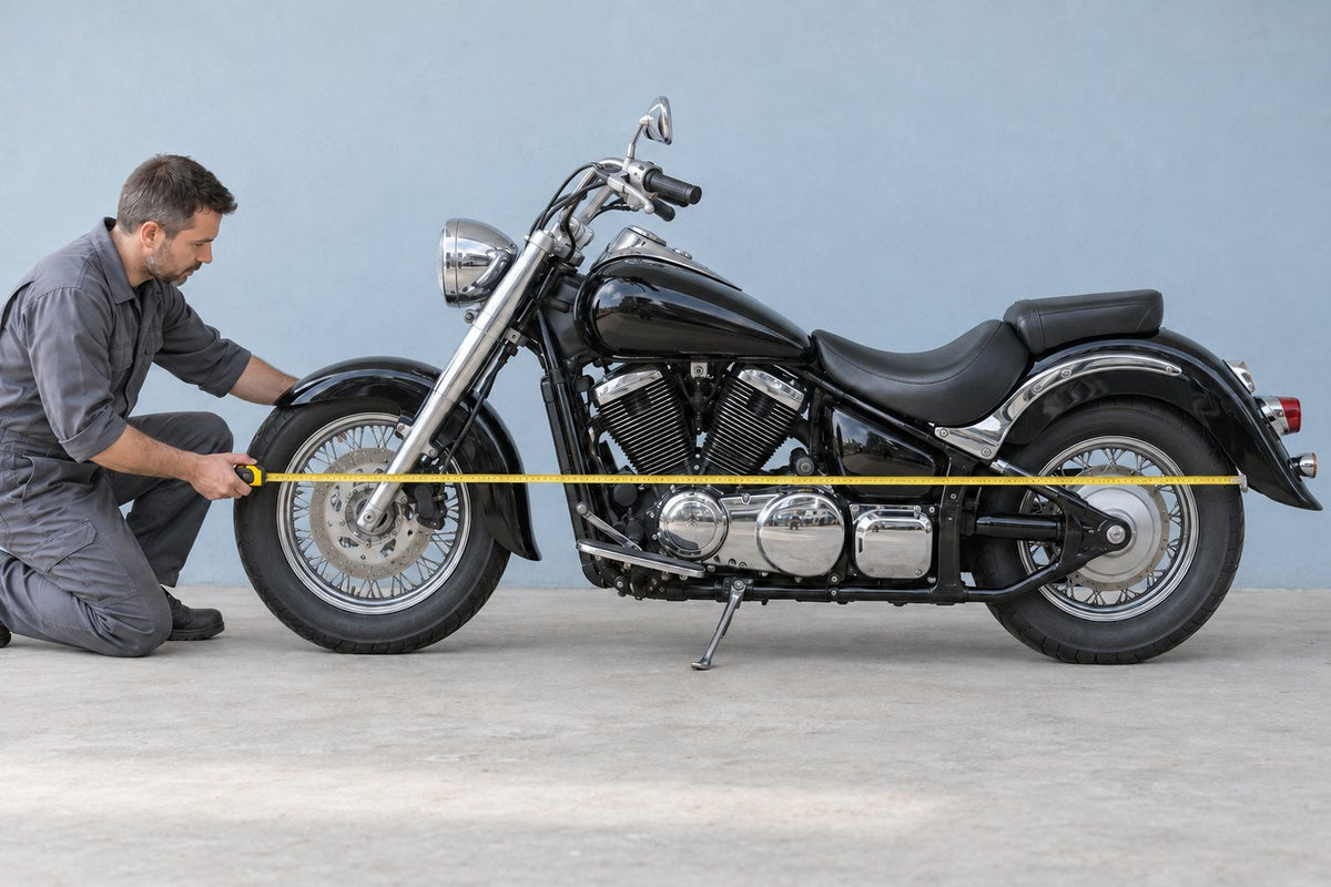 A person measuring the length of a motorcycle with a tape measure