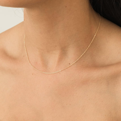 1.5mm 14k gold cable chain necklace for women shown in use